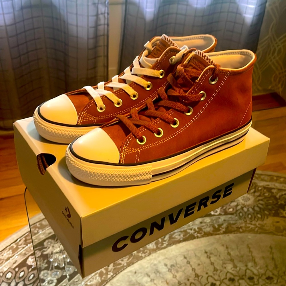 Brand new Converse brown suede shoes never worn or use. Fresh out of the box.